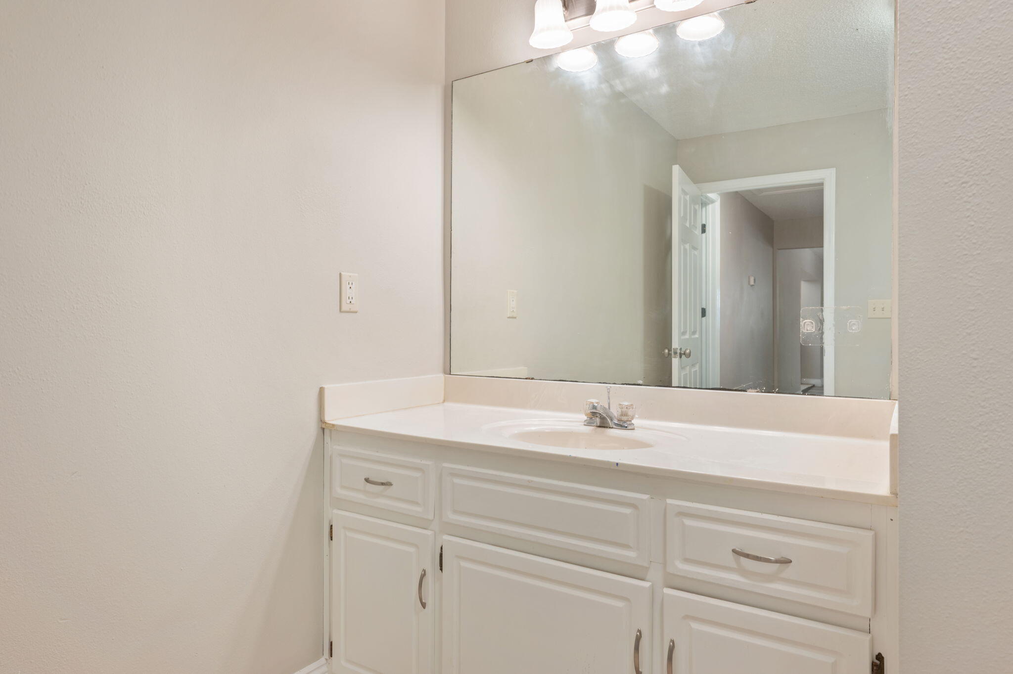 165 Smith Street Crestview, FL 32539 - Photo 17 of 30 a bathroom with a sink and a mirror