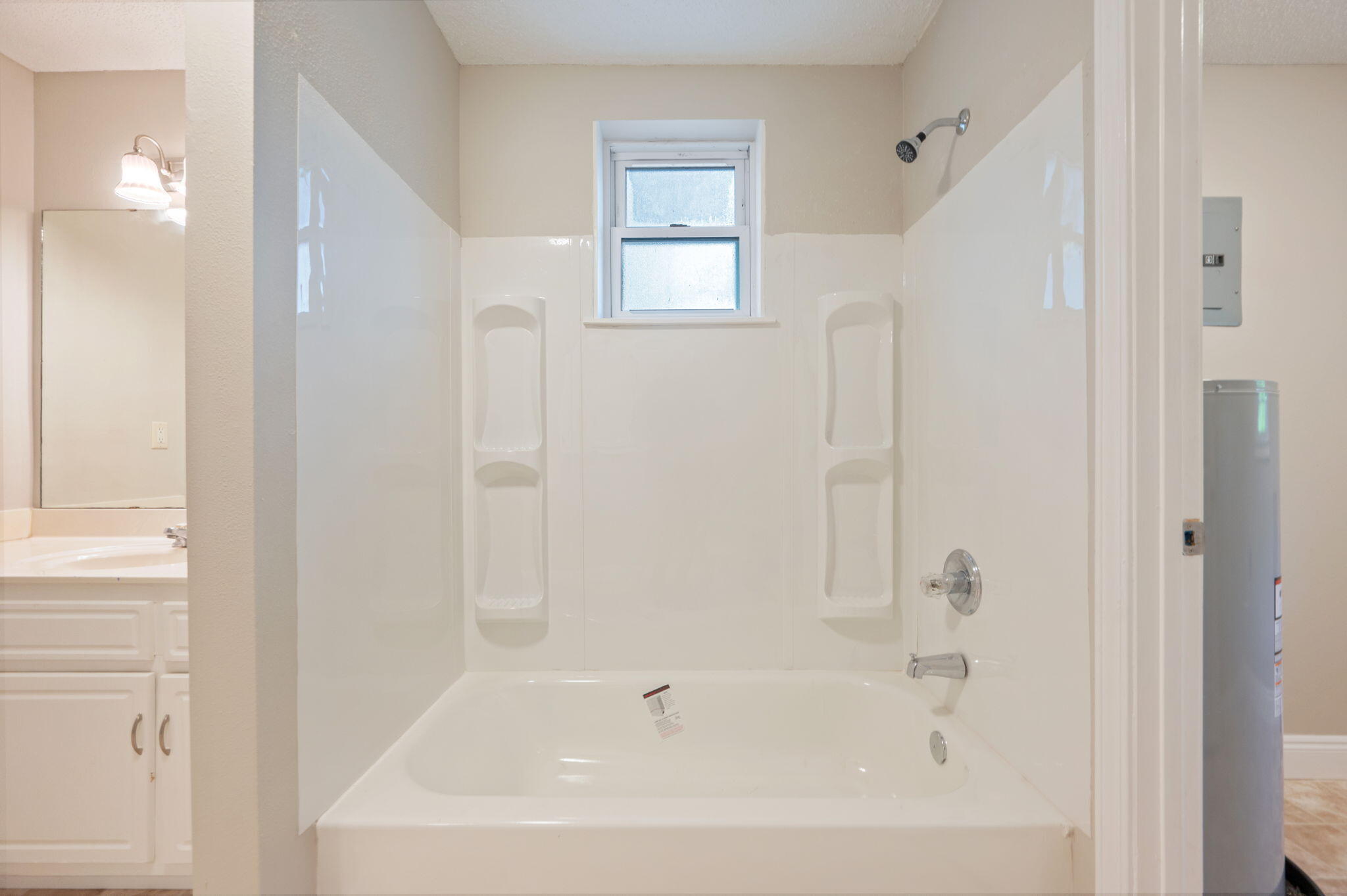 165 Smith Street Crestview, FL 32539 - Photo 18 of 30 a white bath tub sitting next to a window