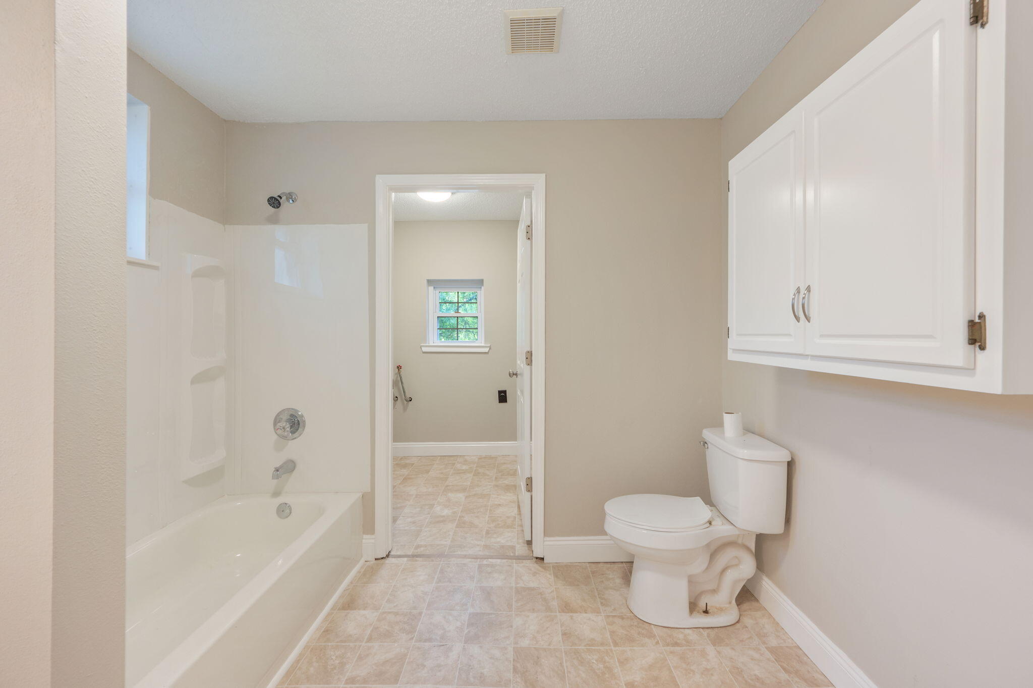 165 Smith Street Crestview, FL 32539 - Photo 19 of 30 a bathroom with a toilet and a shower
