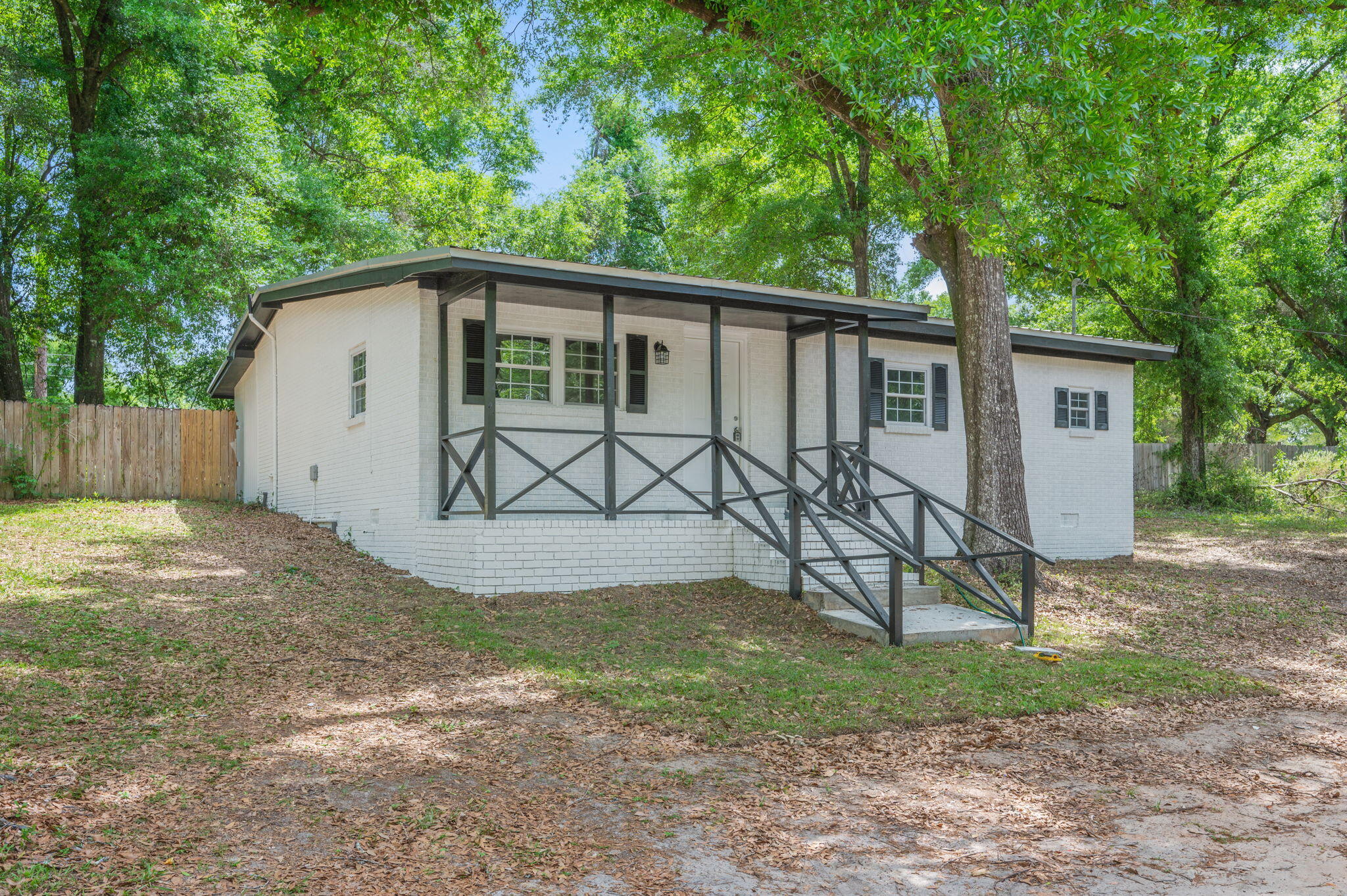 165 Smith Street Crestview, FL 32539 - Photo 2 of 30 a view of a house with backyard and sitting area