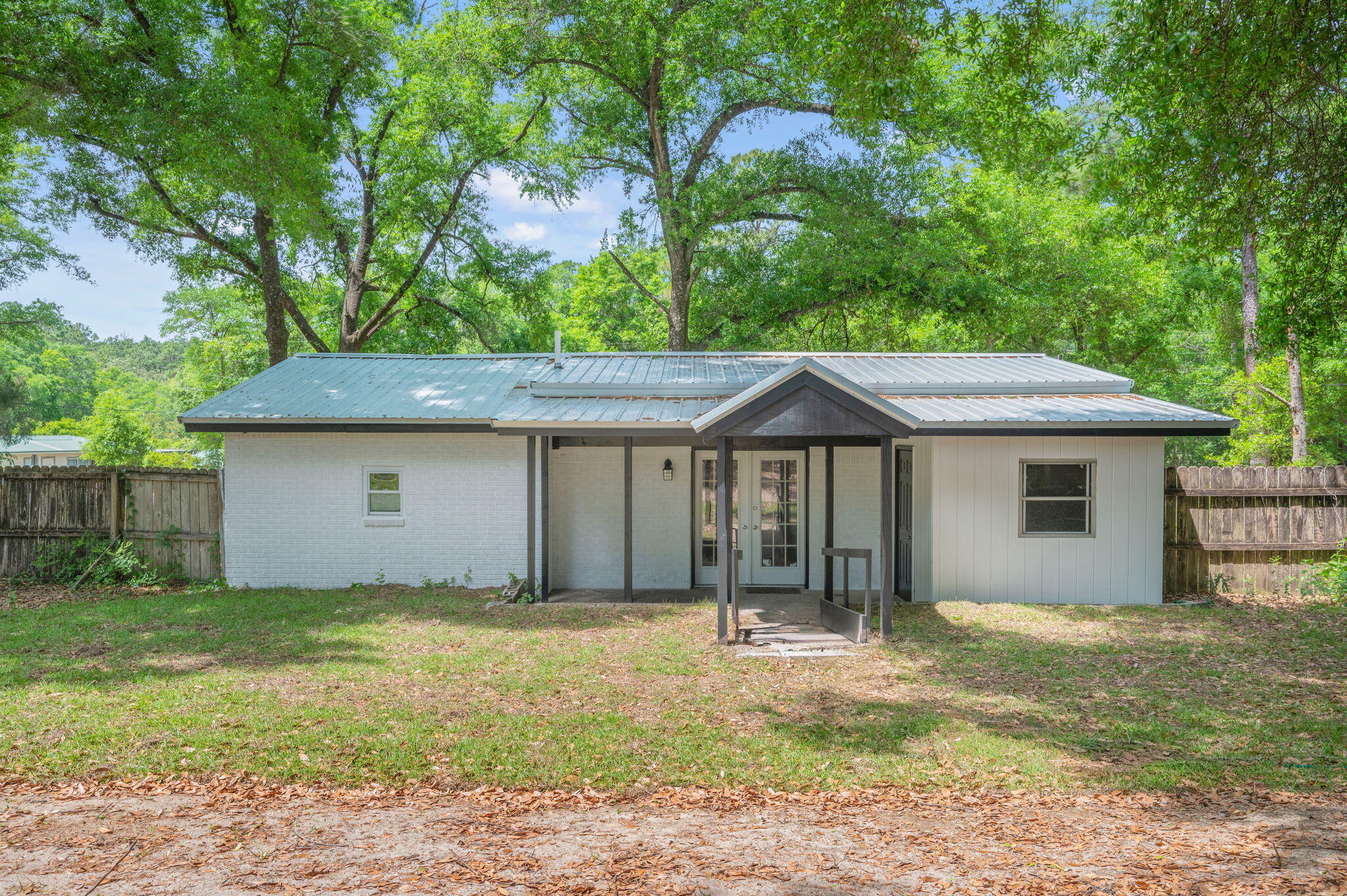 165 Smith Street Crestview, FL 32539 - Photo 24 of 30 a front view of a house with a yard