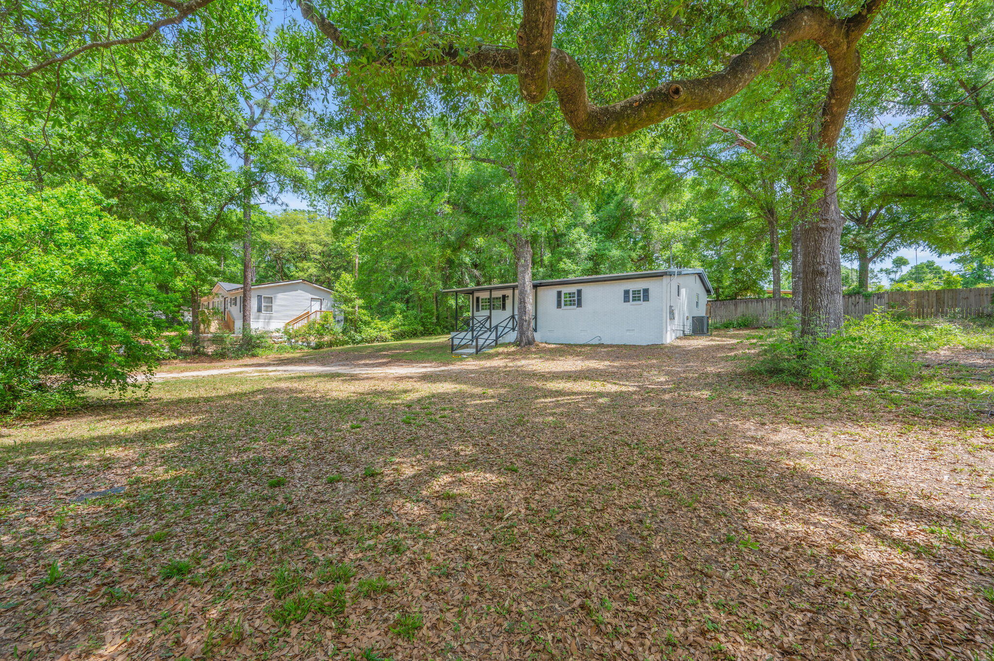 165 Smith Street Crestview, FL 32539 - Photo 30 of 30 a view of a house with a yard and a large tree