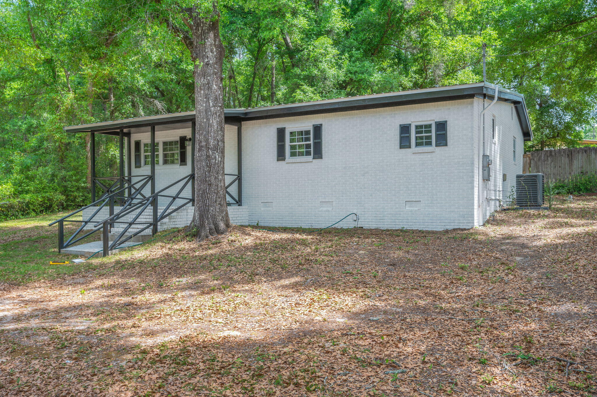 165 Smith Street Crestview, FL 32539 - Photo 3 of 30 a backyard of a house with lots of green space