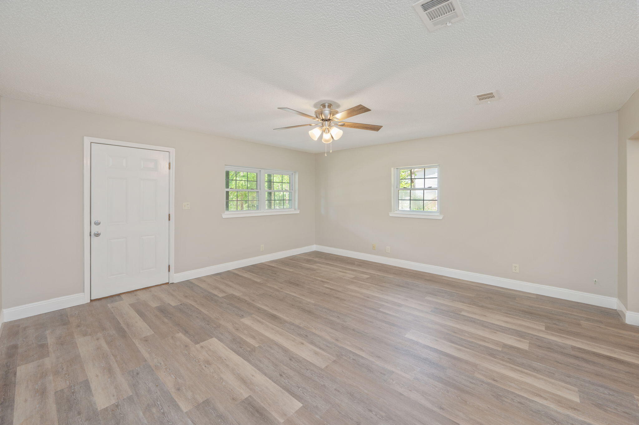 165 Smith Street Crestview, FL 32539 - Photo 7 of 30 a view of an empty room with a window