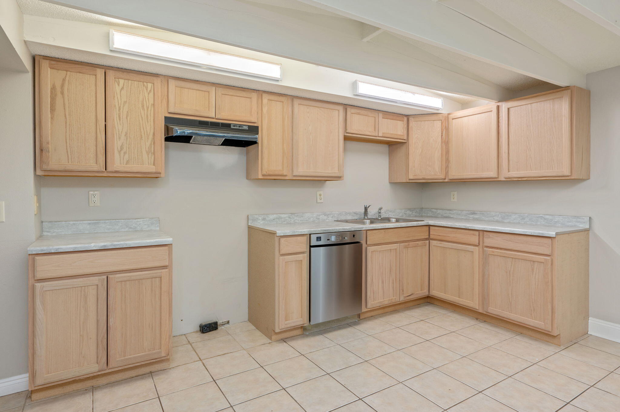 165 Smith Street Crestview, FL 32539 - Photo 9 of 30 a kitchen with white cabinets and white appliances