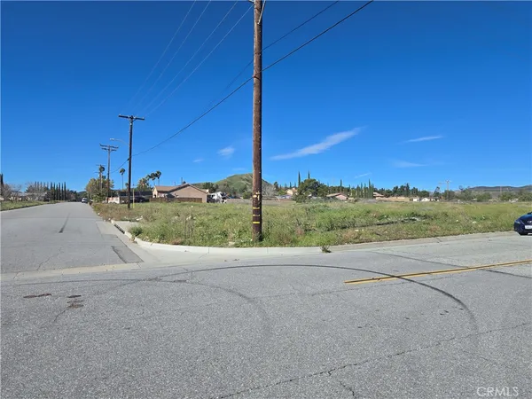 a view of a road with a building in the background
