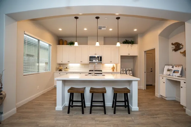a bedroom with a bed and a potted plant