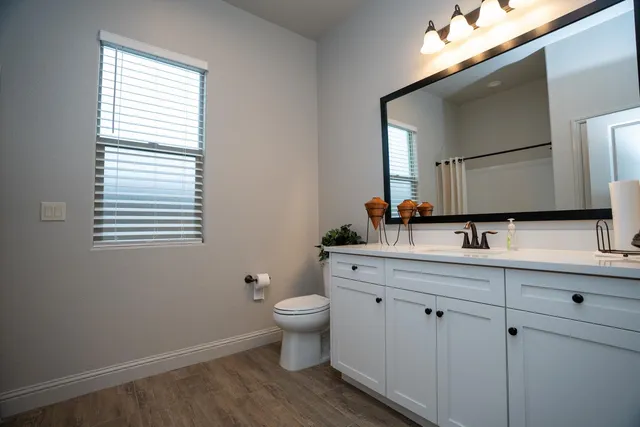 a living room with furniture and a lamp