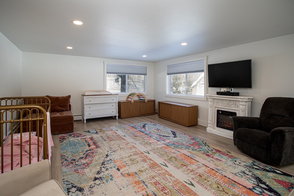 71 County Street Lakeville, MA 02347 - Photo 14 of 36 a living room with furniture and a flat screen tv