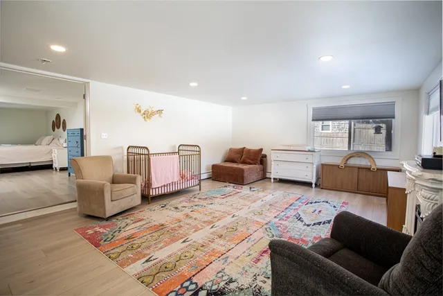 a bedroom with furniture and white walls