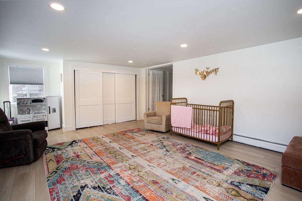 71 County Street Lakeville, MA 02347 - Photo 16 of 36 a very nice looking bedroom with a bed and wooden floor