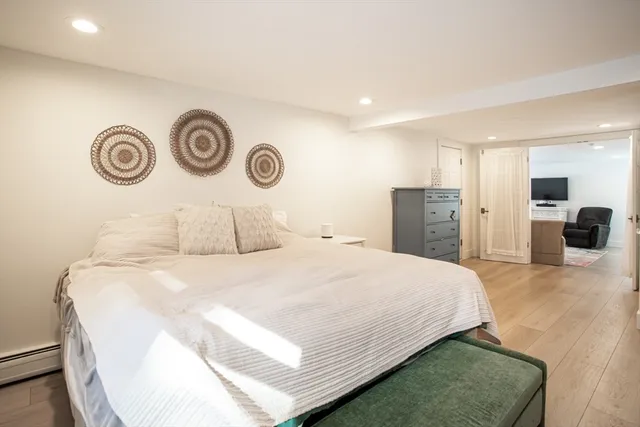 a bedroom with a bed and a couch