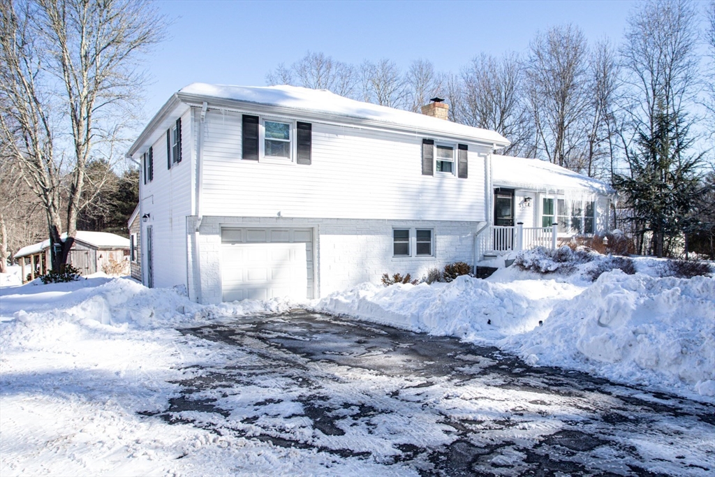 71 County Street Lakeville, MA 02347 - Photo 2 of 36 a front view of a house with a yard covered in snow