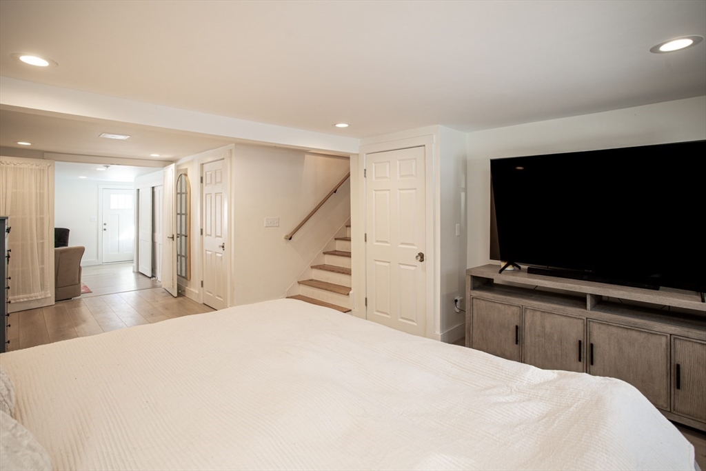 71 County Street Lakeville, MA 02347 - Photo 21 of 36 a bedroom with a bed and a flat screen tv