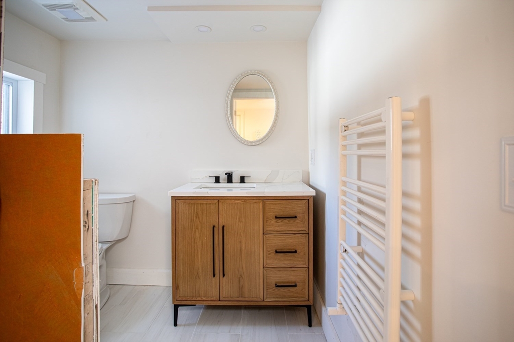 71 County Street Lakeville, MA 02347 - Photo 22 of 36 a bathroom with a sink and a mirror