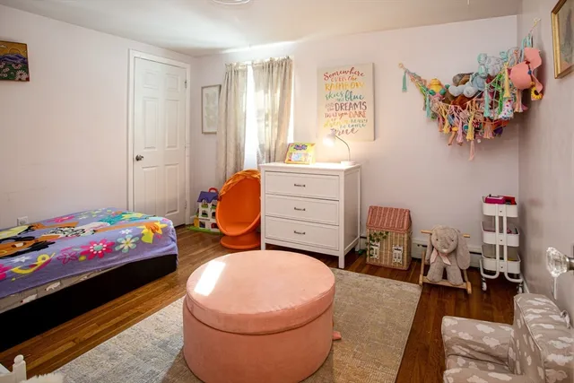 a bedroom with a bed and furniture