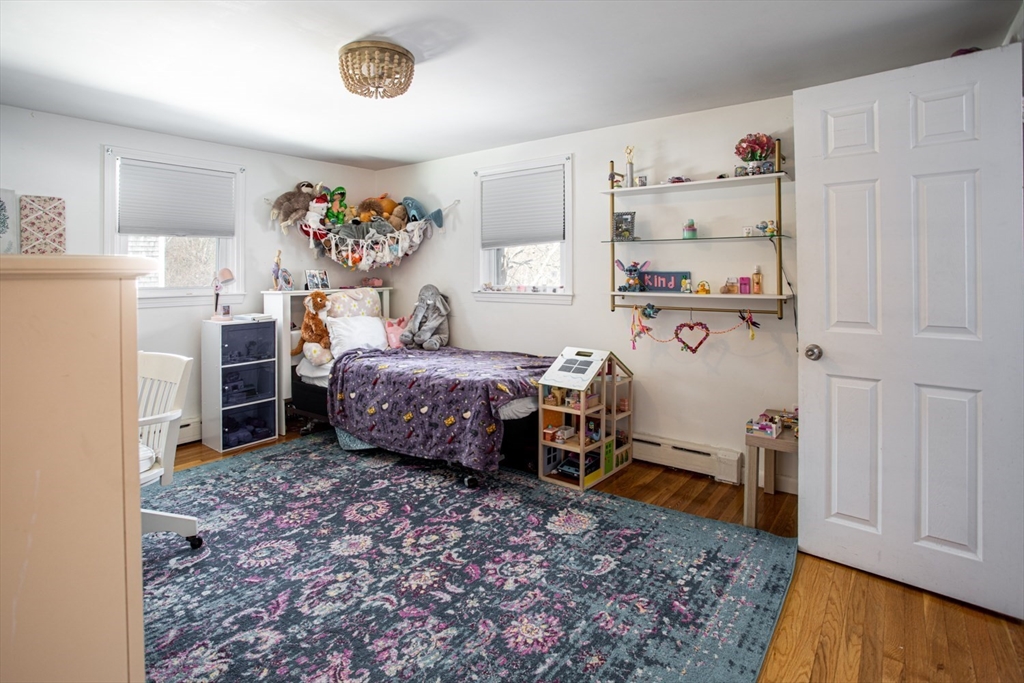 71 County Street Lakeville, MA 02347 - Photo 26 of 36 a bedroom with a bed and a dresser in it