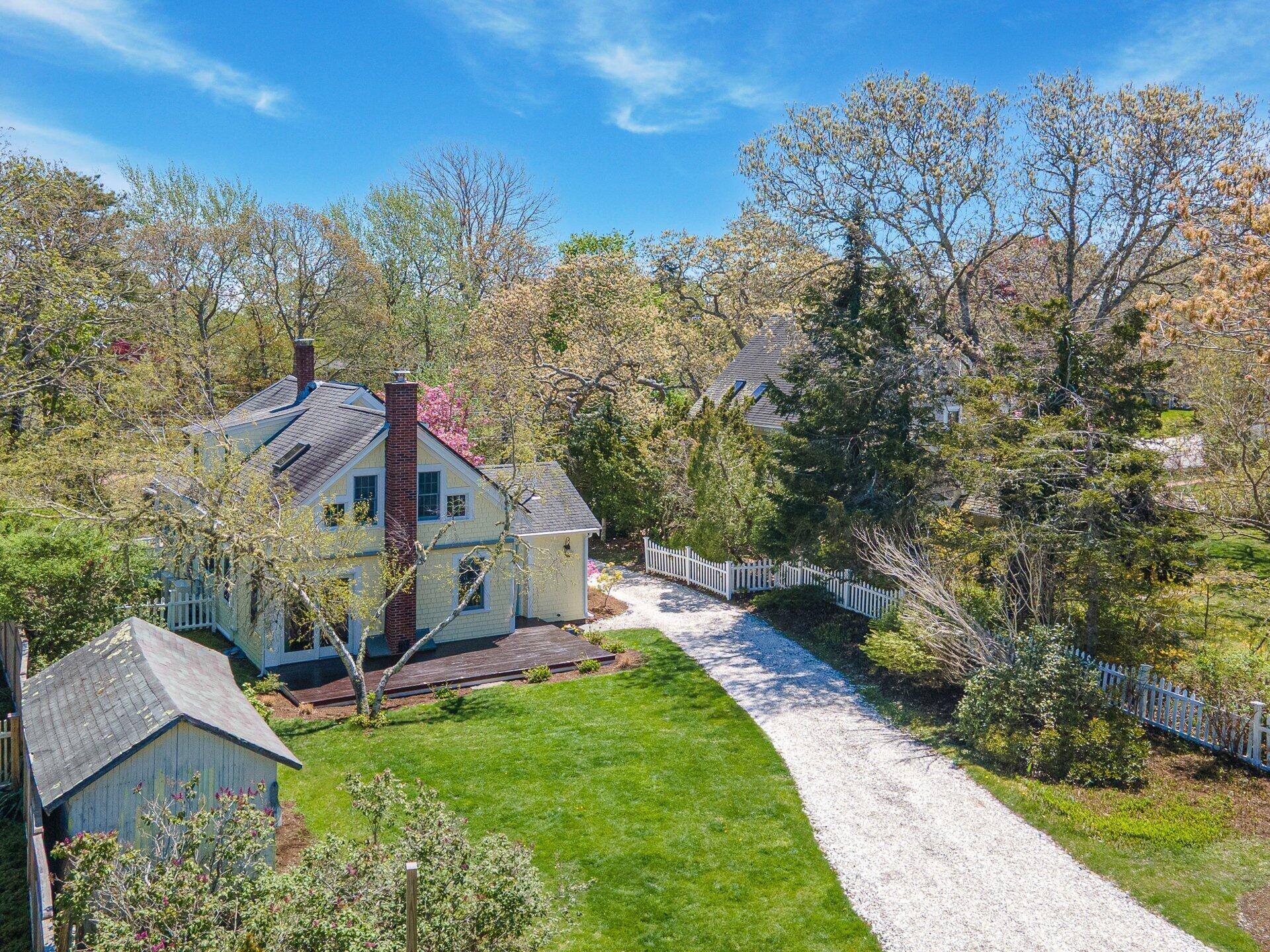 1089 Main Street Cotuit, MA 02635 - Photo 36 of 41 a view of a house with a yard