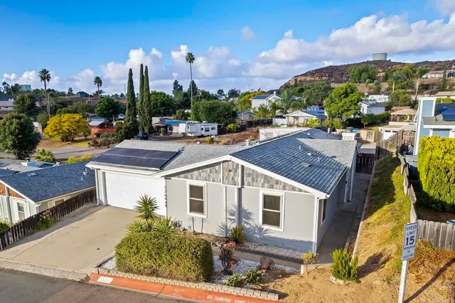 a aerial view of a house with swimming pool and sitting area
