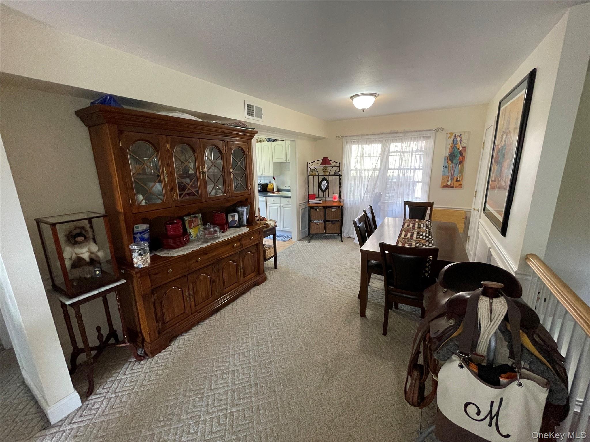 107 Mariners Way Copiague, NY 11726 - Photo 15 of 27 a living room with furniture and a flat screen tv