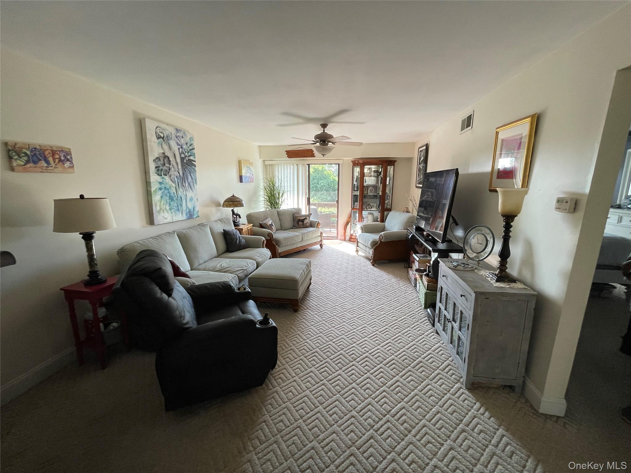 107 Mariners Way Copiague, NY 11726 - Photo 17 of 27 a living room with furniture
