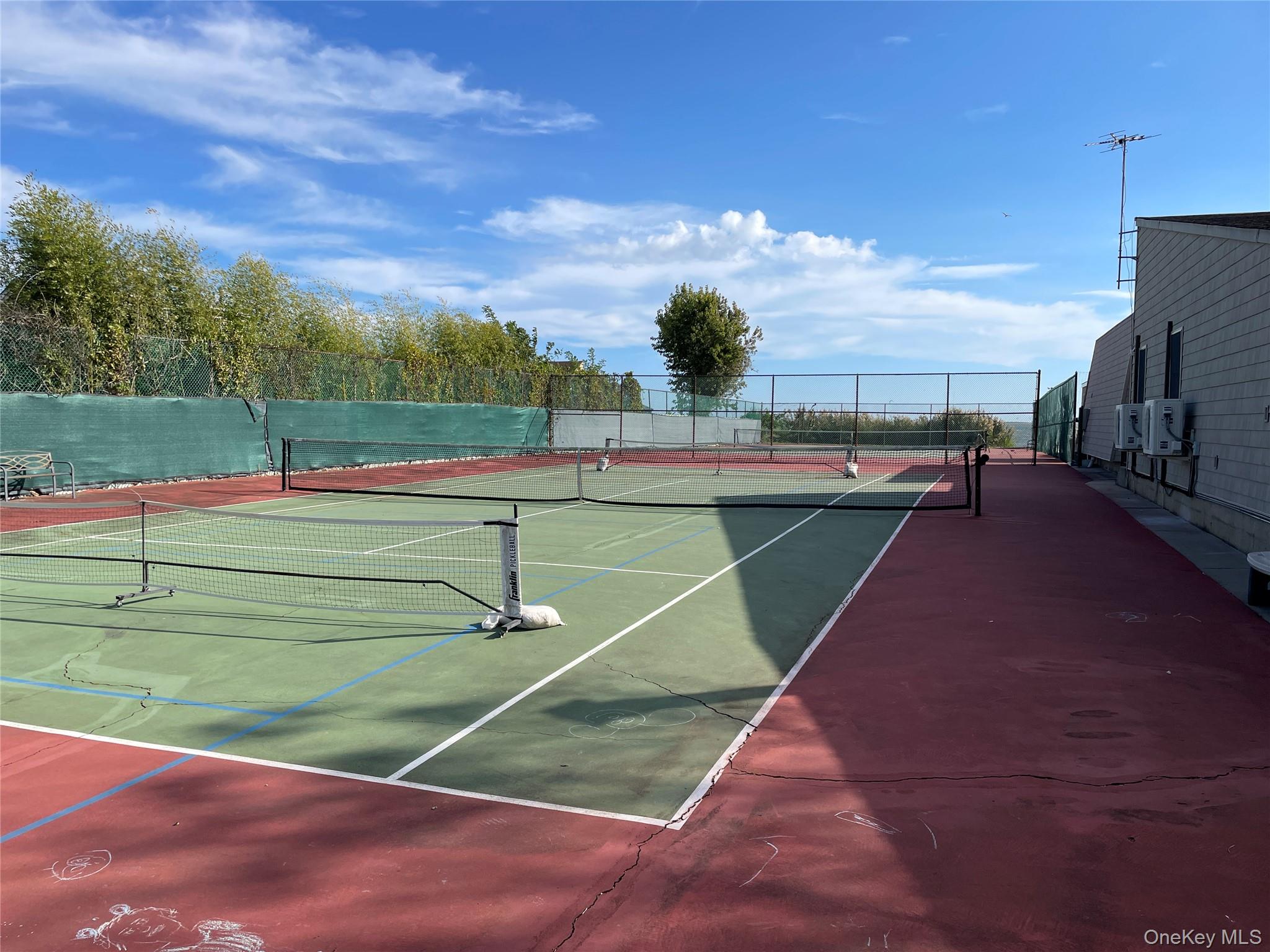 107 Mariners Way Copiague, NY 11726 - Photo 26 of 27 a view of a tennis court