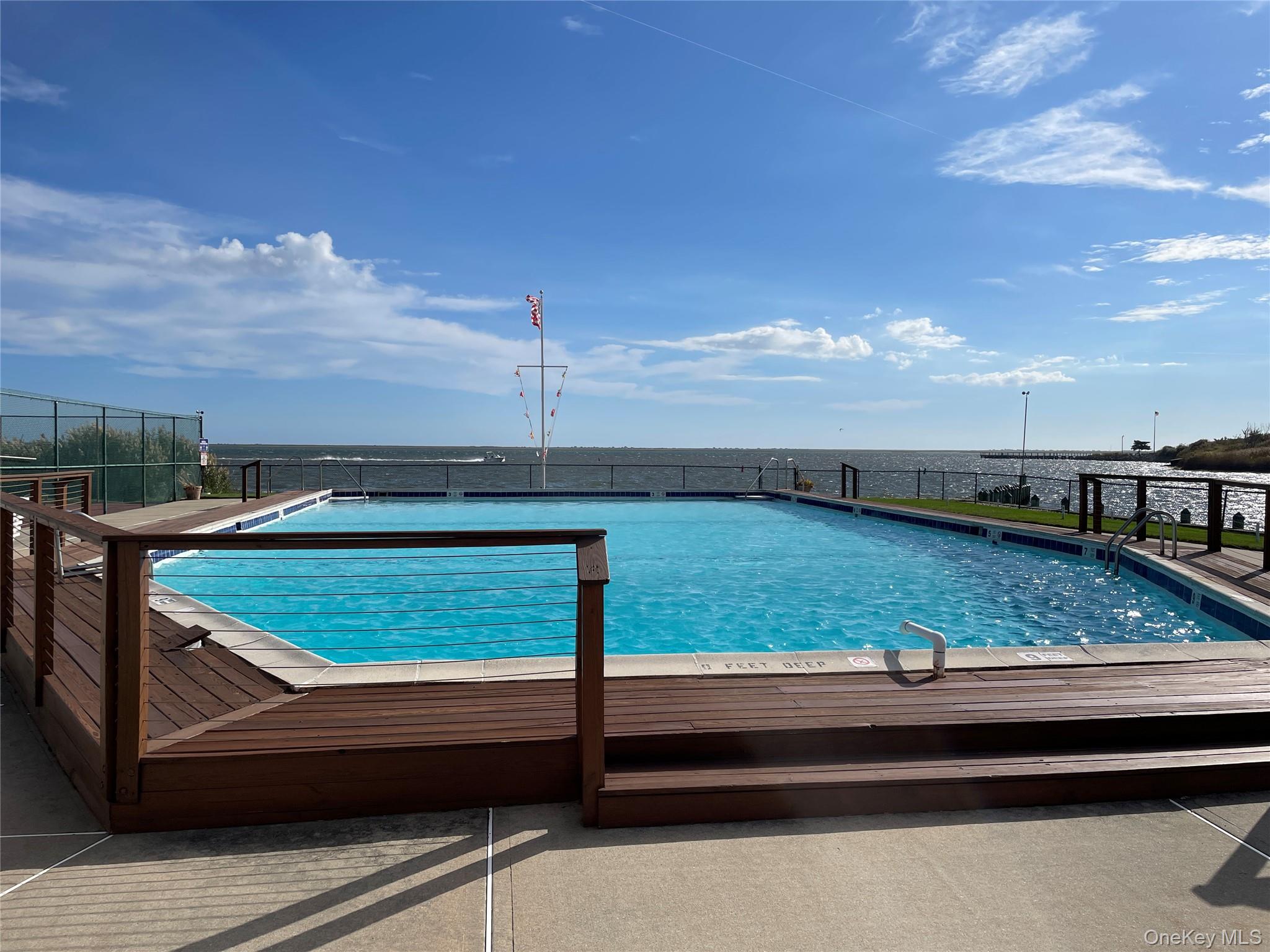107 Mariners Way Copiague, NY 11726 - Photo 27 of 27 a view of swimming pool with furniture