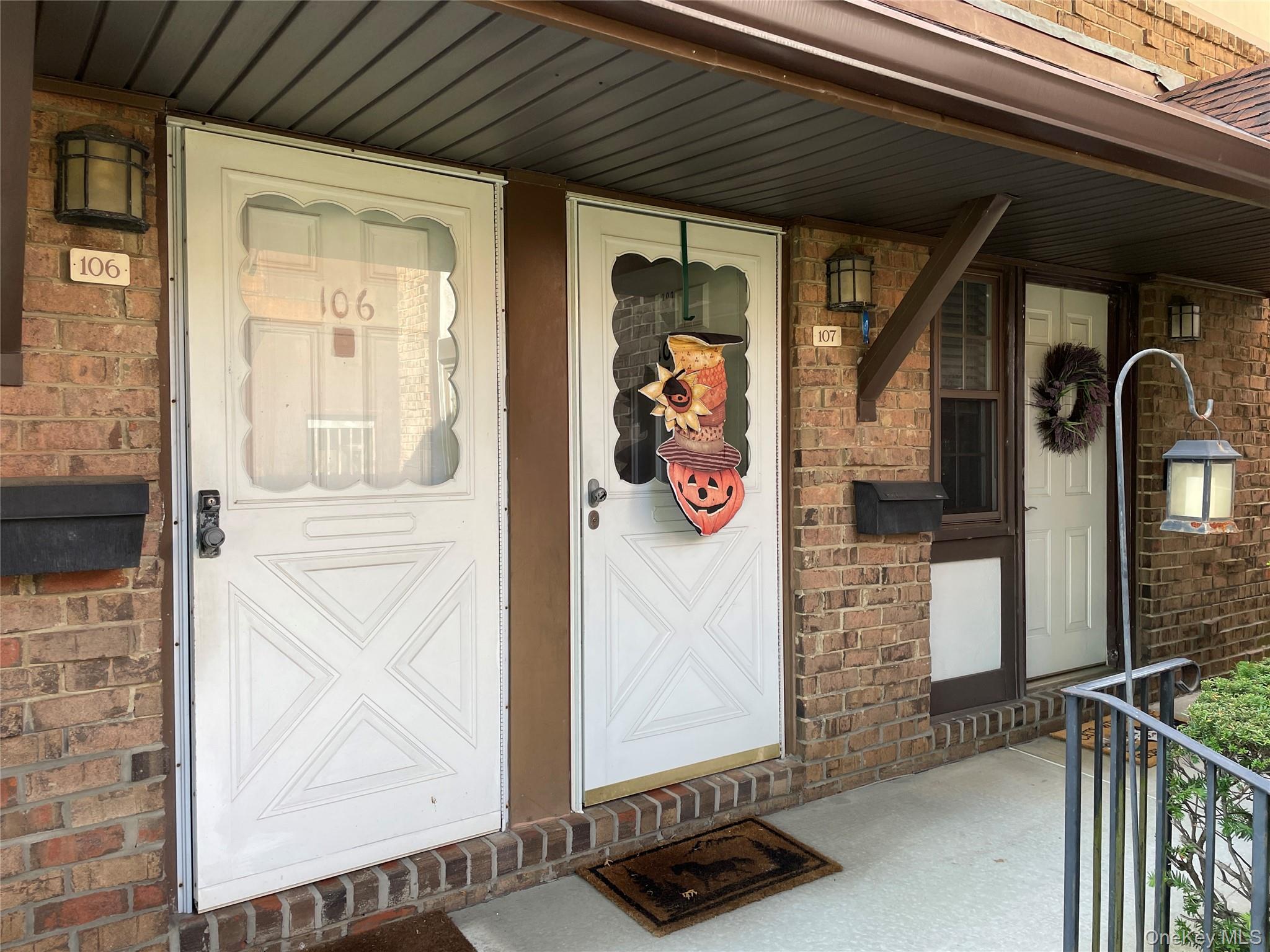 107 Mariners Way Copiague, NY 11726 - Photo 3 of 27 a view of front door of house