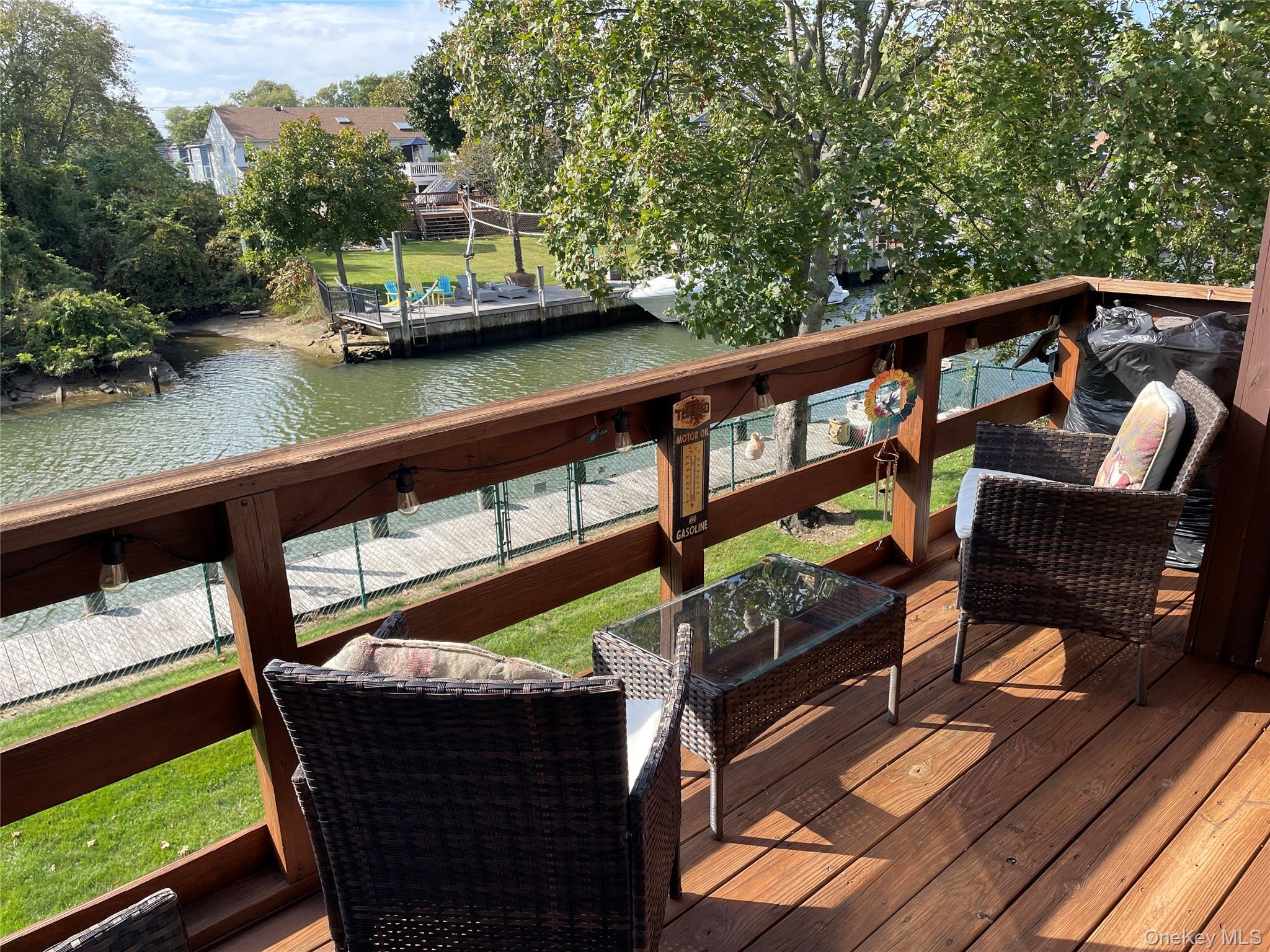 107 Mariners Way Copiague, NY 11726 - Photo 4 of 27 a view of outdoor from deck with seating area