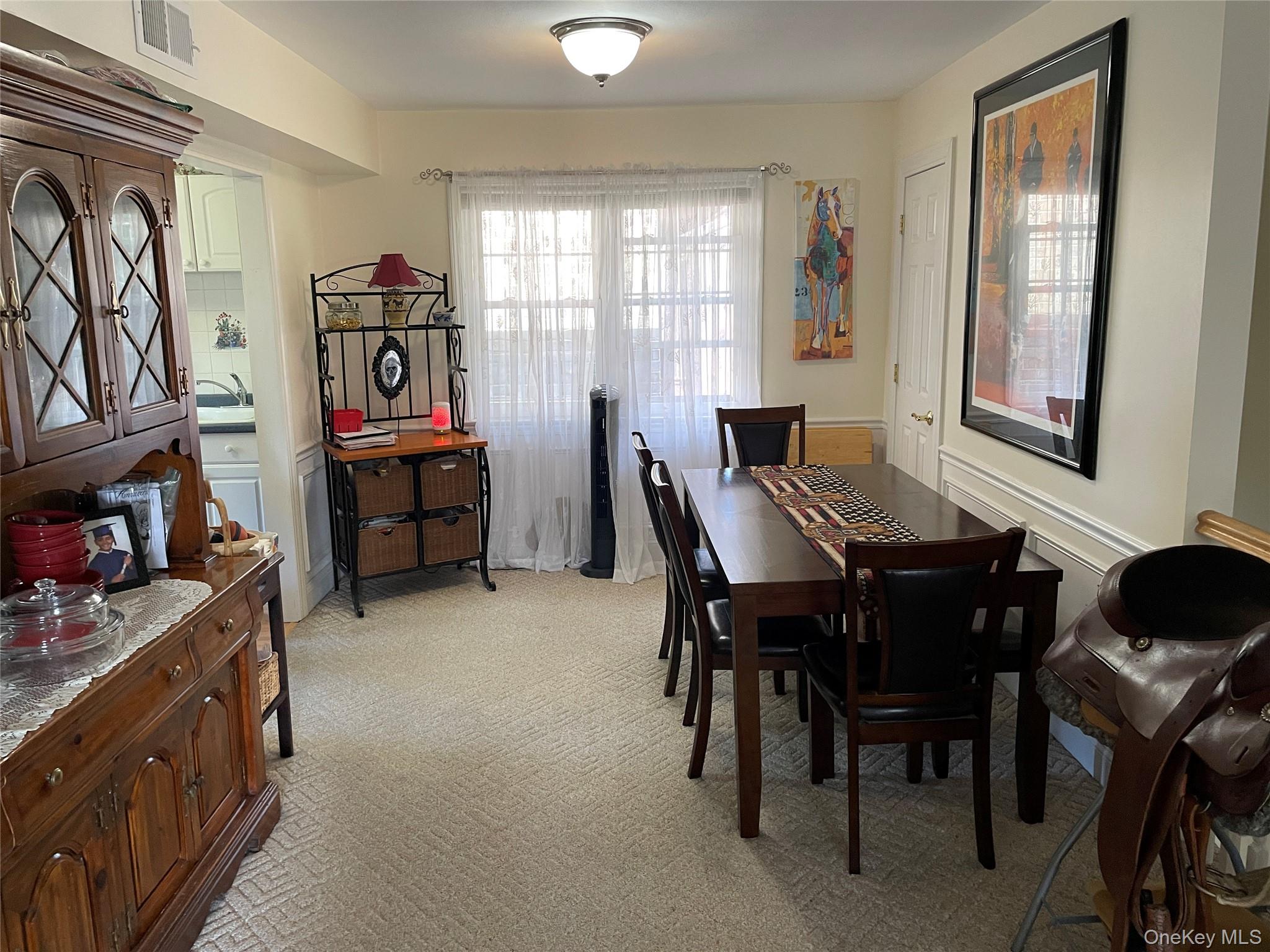 107 Mariners Way Copiague, NY 11726 - Photo 8 of 27 a view of a livingroom with furniture and window
