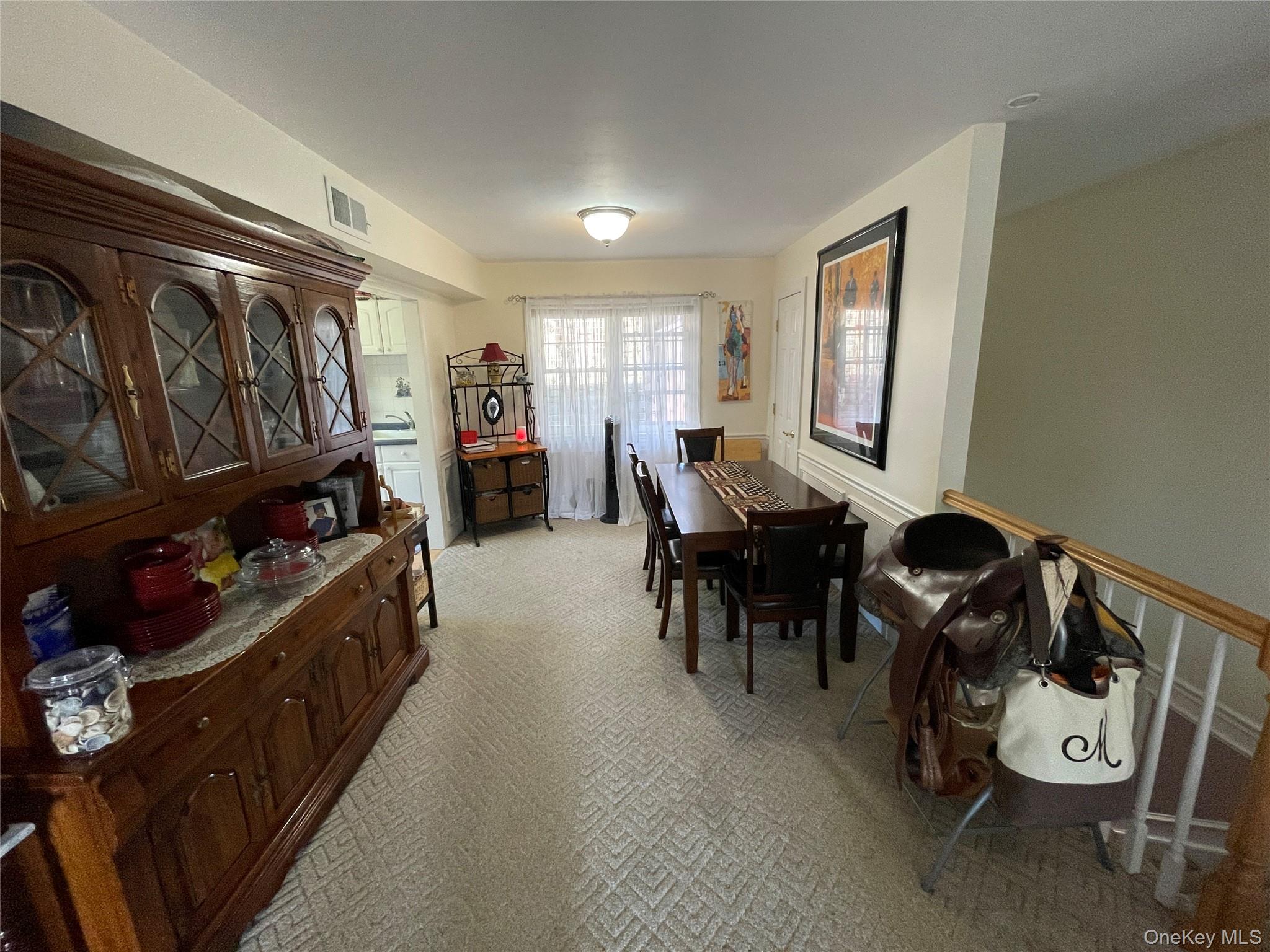 107 Mariners Way Copiague, NY 11726 - Photo 9 of 27 a living room with furniture and a window