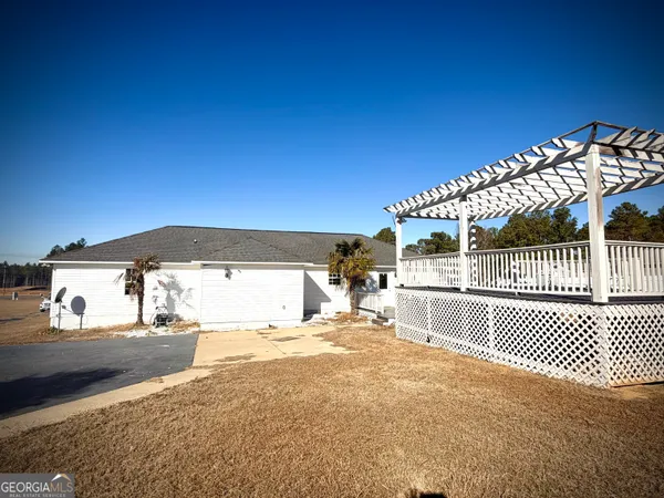 a view of a patio with a yard