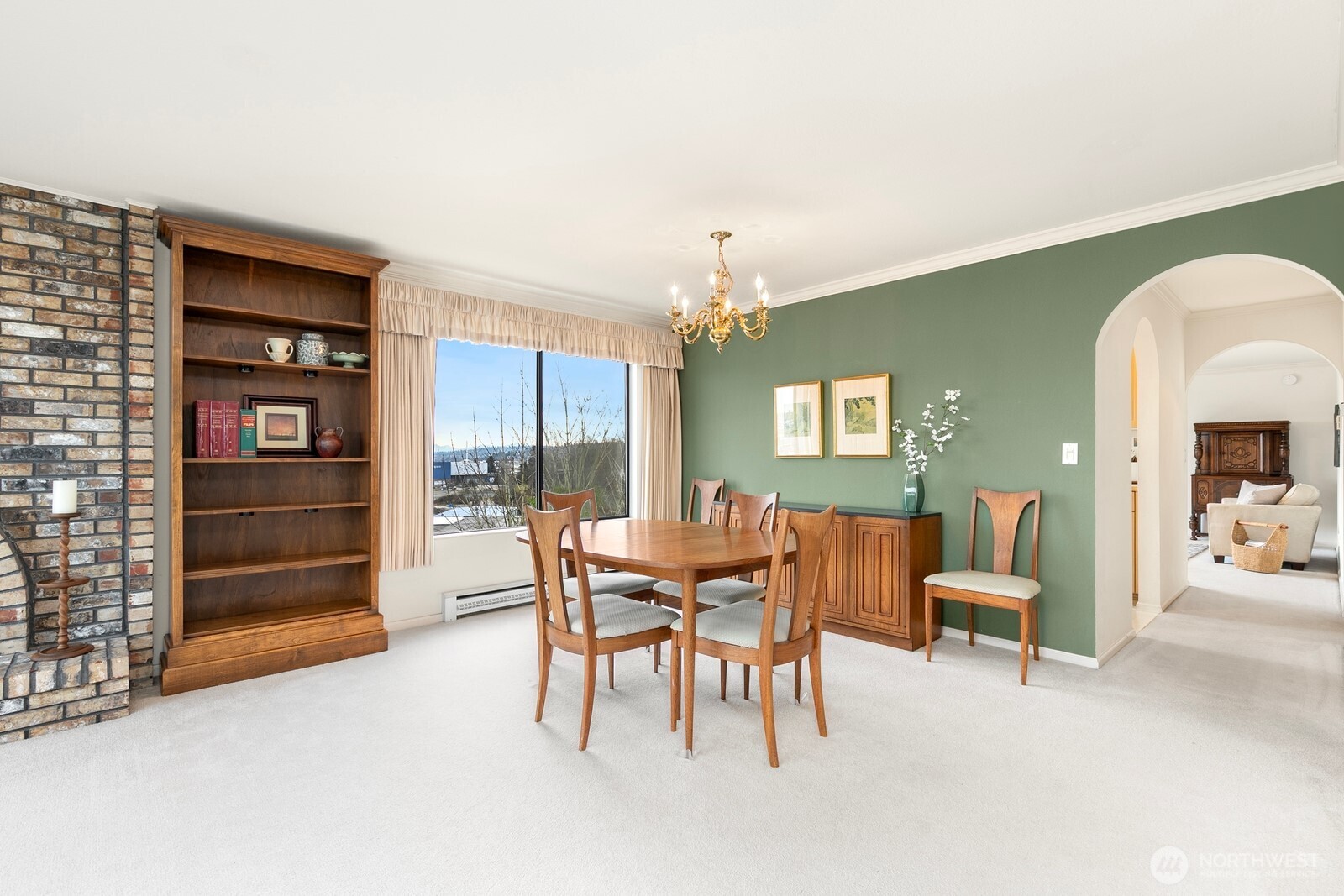 3113 West Harley Street, Unit 3115 Seattle, WA 98199 - Photo 12 of 28 a dining room with furniture and chandelier