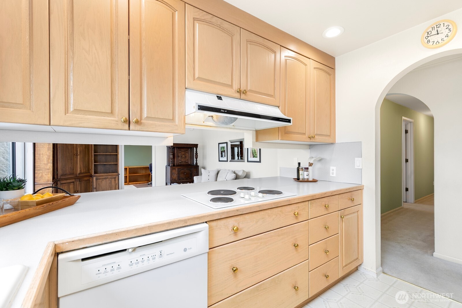 3113 West Harley Street, Unit 3115 Seattle, WA 98199 - Photo 16 of 28 a kitchen with stainless steel appliances granite countertop a sink and cabinets