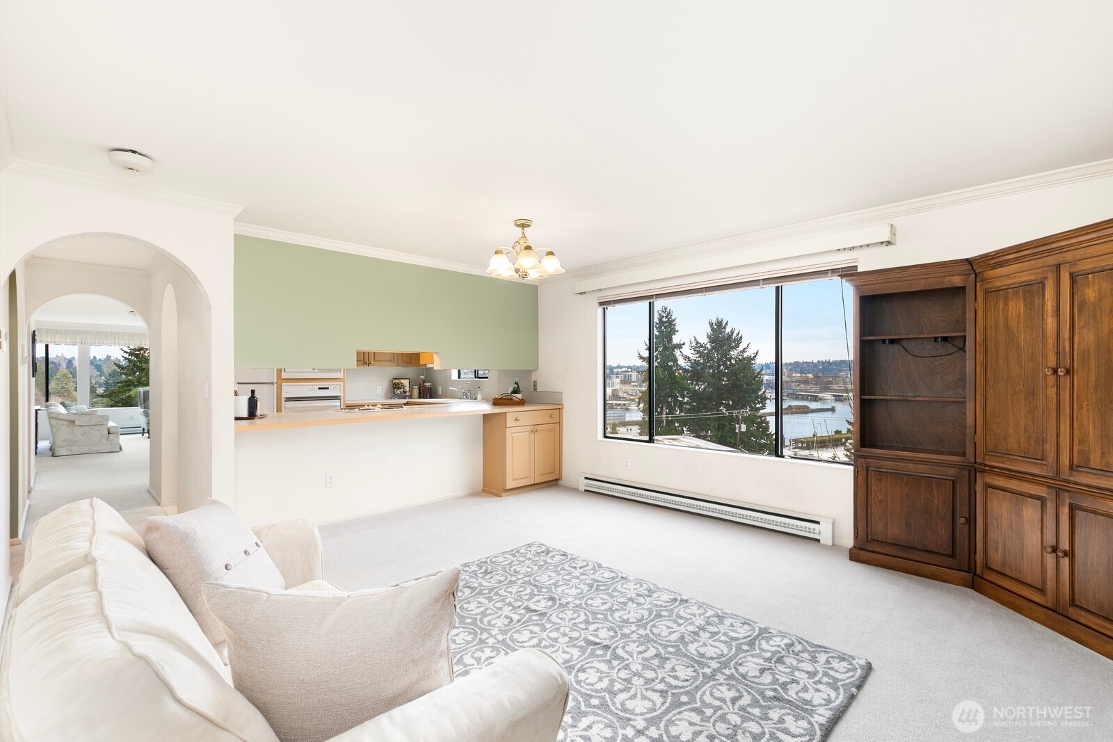 3113 West Harley Street, Unit 3115 Seattle, WA 98199 - Photo 17 of 28 a living room with furniture and a large window