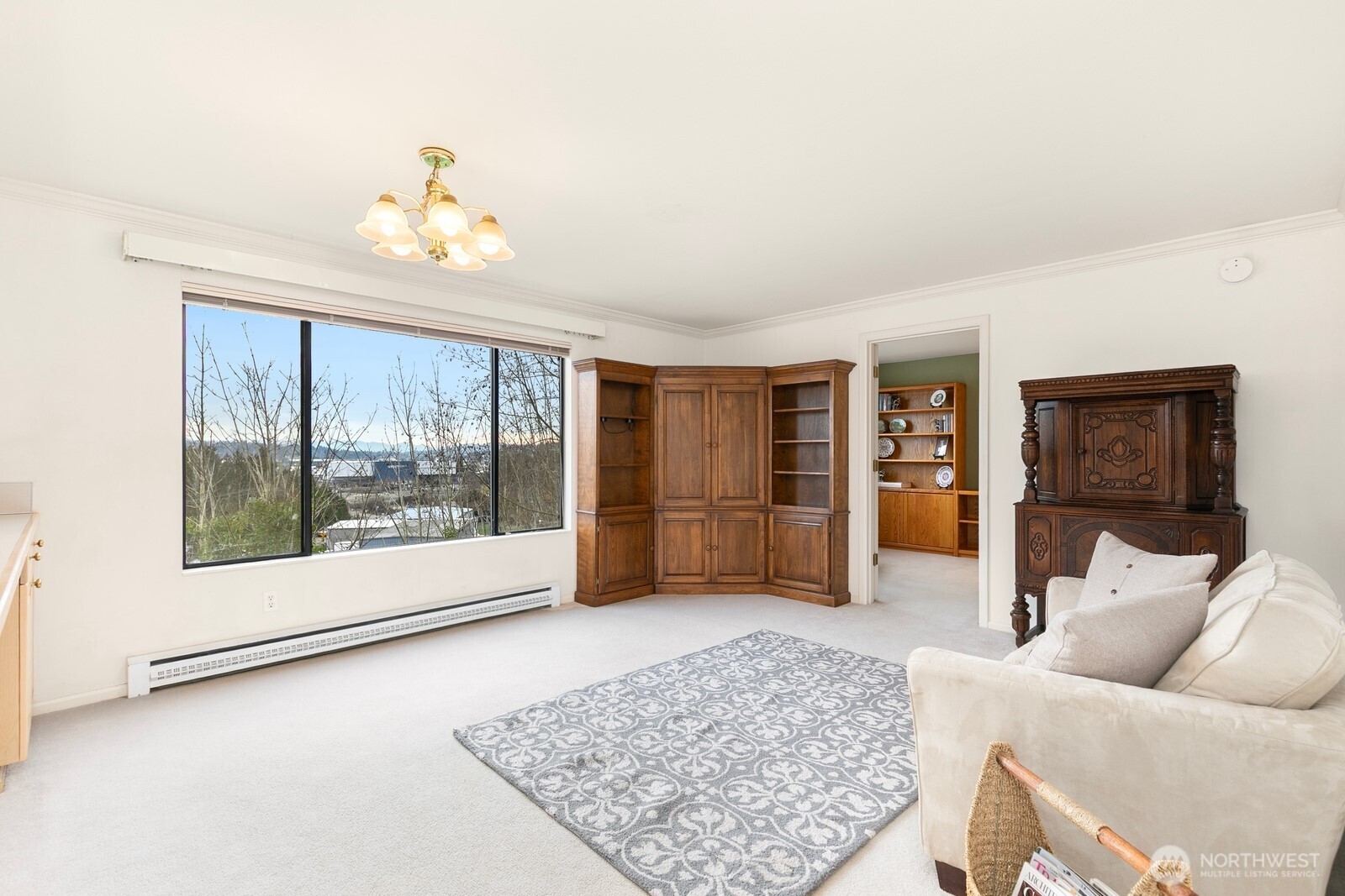 3113 West Harley Street, Unit 3115 Seattle, WA 98199 - Photo 19 of 28 a living room with furniture and a large window