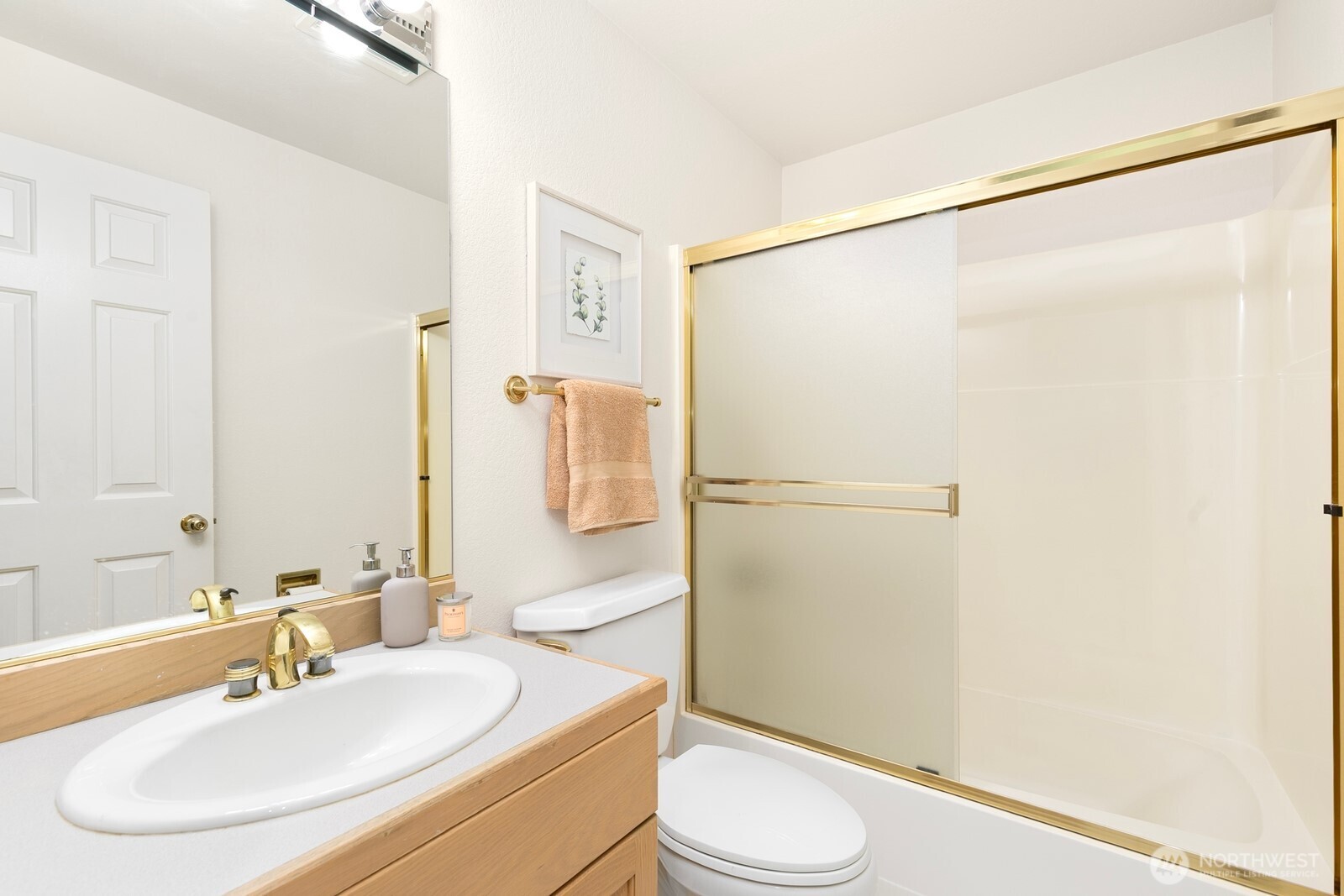 3113 West Harley Street, Unit 3115 Seattle, WA 98199 - Photo 26 of 28 a bathroom with a sink toilet and shower