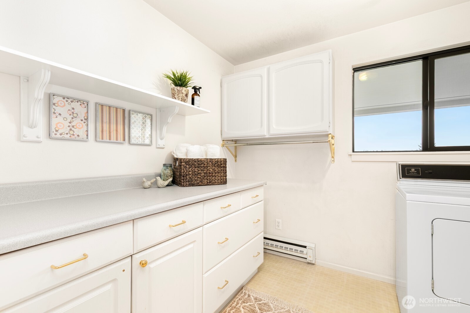 3113 West Harley Street, Unit 3115 Seattle, WA 98199 - Photo 27 of 28 a kitchen with white cabinets and window