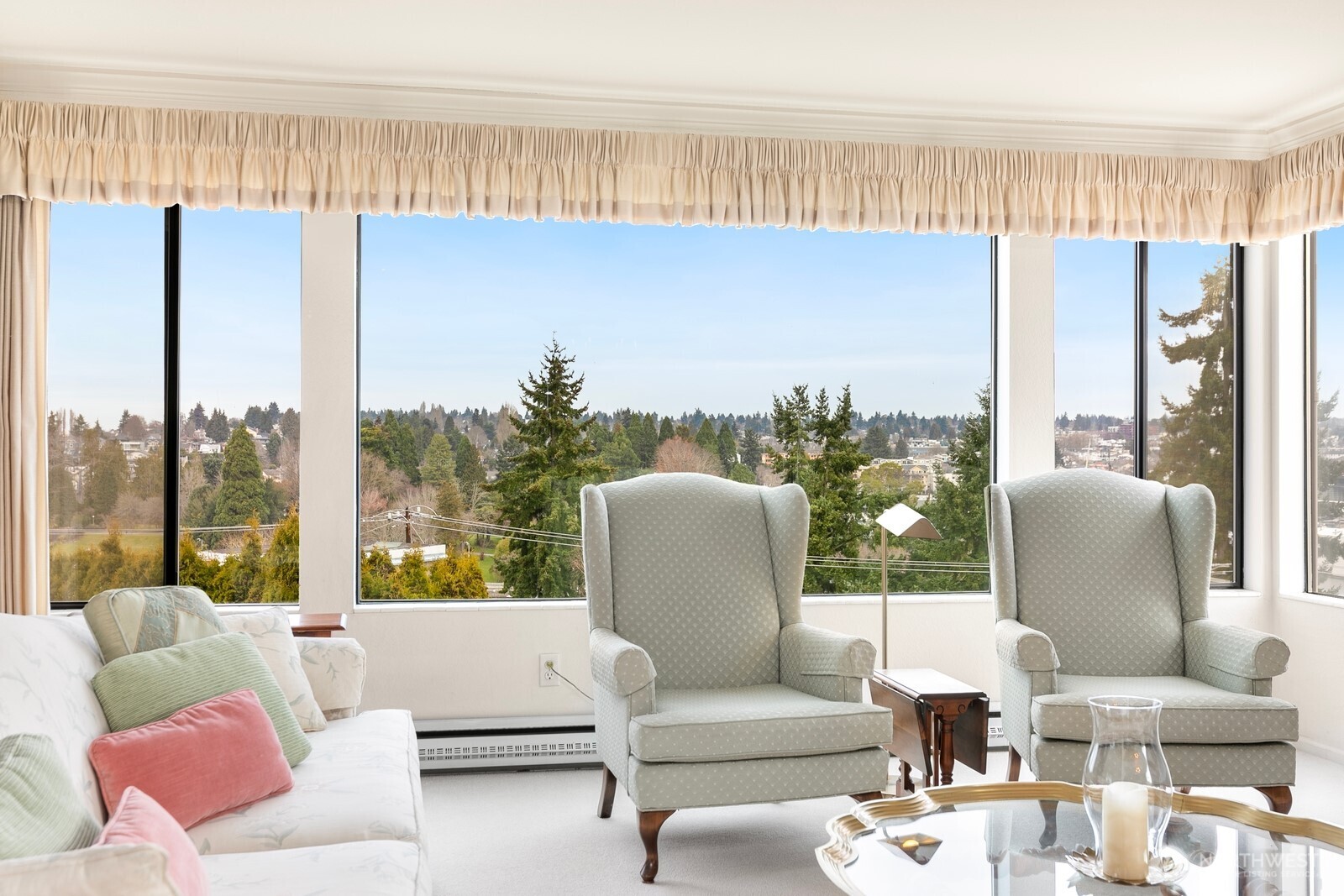 3113 West Harley Street, Unit 3115 Seattle, WA 98199 - Photo 4 of 28 a living room with furniture and a large window
