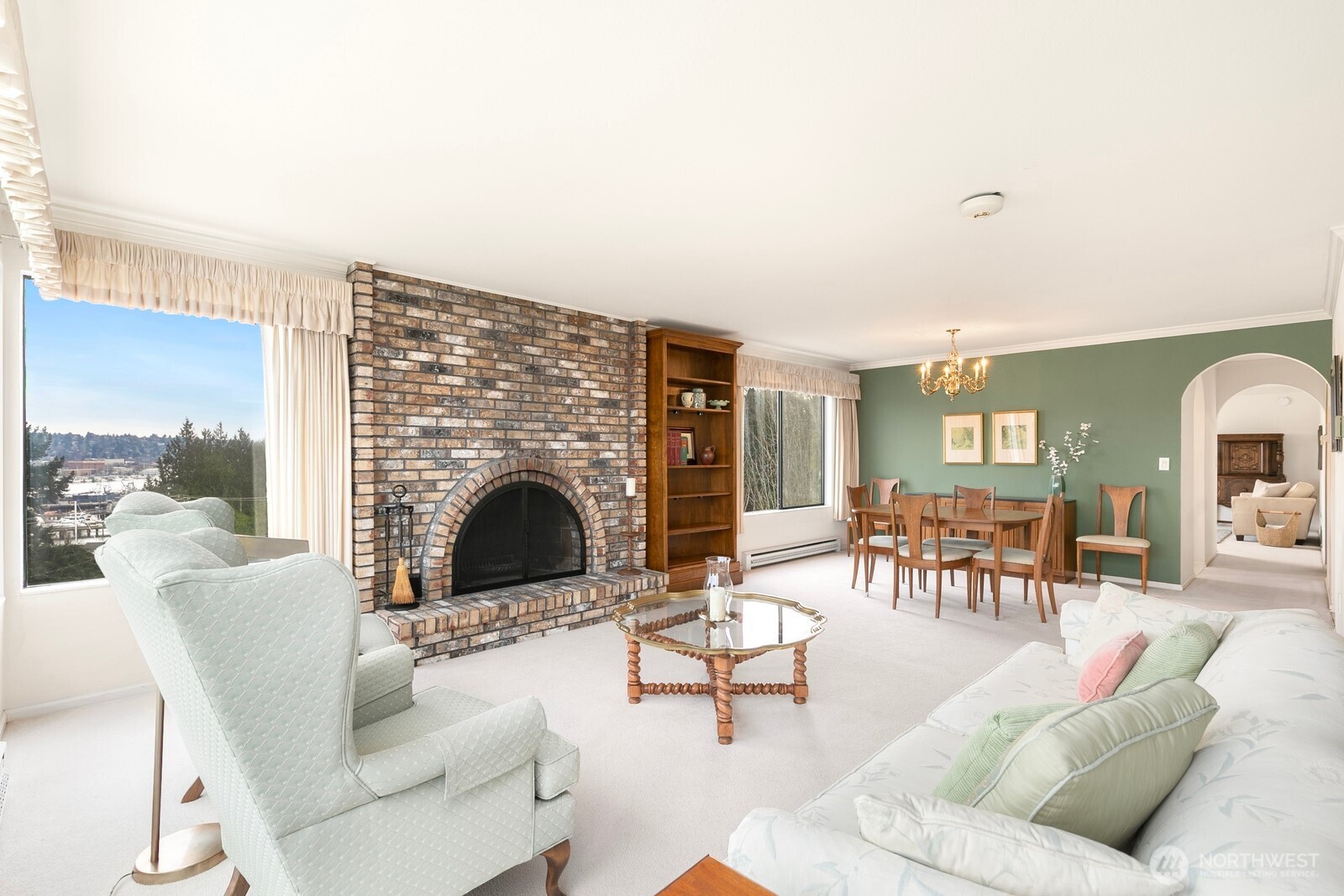3113 West Harley Street, Unit 3115 Seattle, WA 98199 - Photo 6 of 28 a living room with furniture and a fireplace