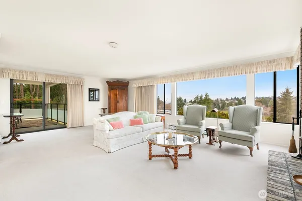 a view of a dining room with furniture window and outside view
