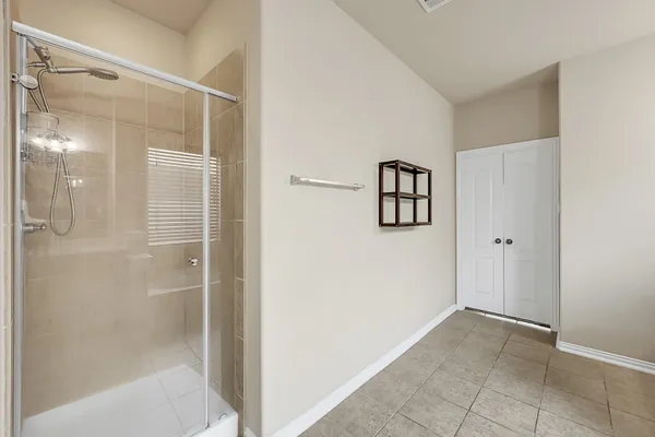 a bathroom with a bathtub and shower