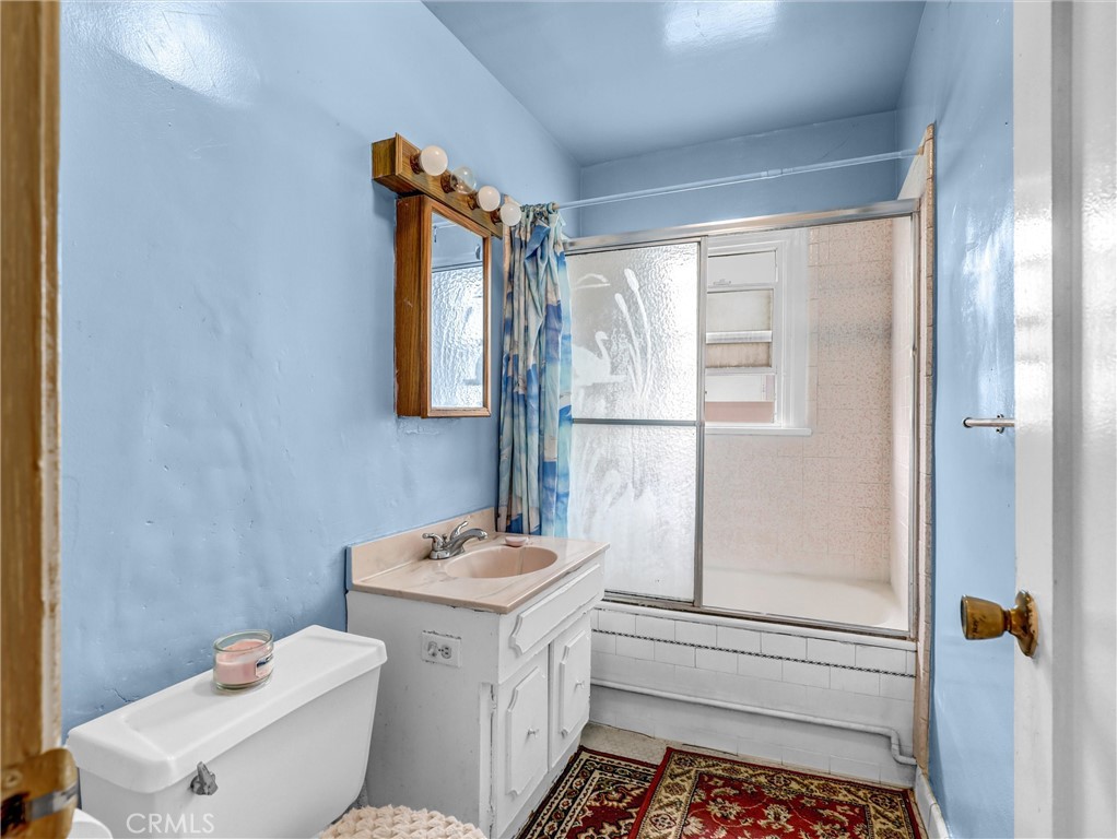 405 South Ward Avenue Compton, CA 90221 - Photo 12 of 28 a bathroom with a sink toilet and shower