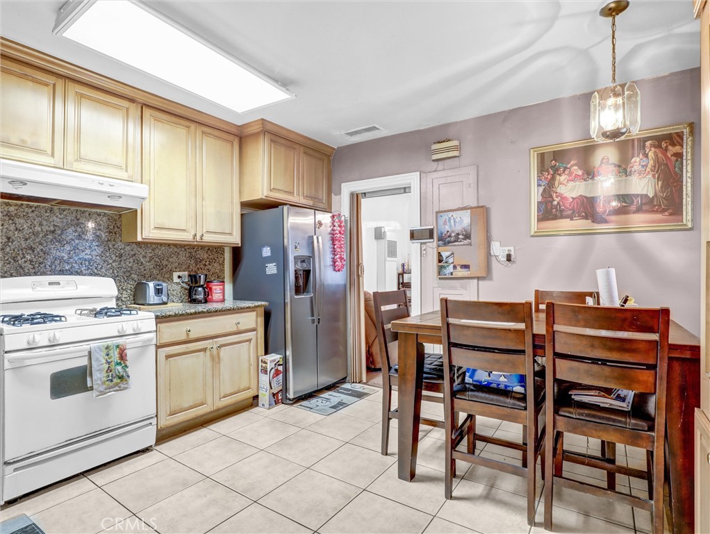 405 South Ward Avenue Compton, CA 90221 - Photo 17 of 28 a kitchen that has a cabinets counter space and appliances