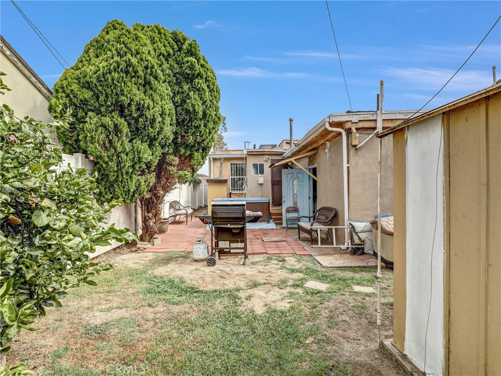 405 South Ward Avenue Compton, CA 90221 - Photo 25 of 28 a view of backyard with a table and chairs and a patio