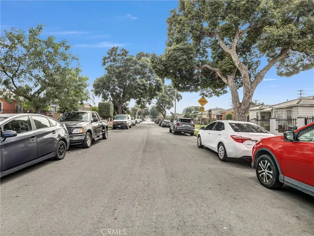 a group of cars parked in a parking lot at street view