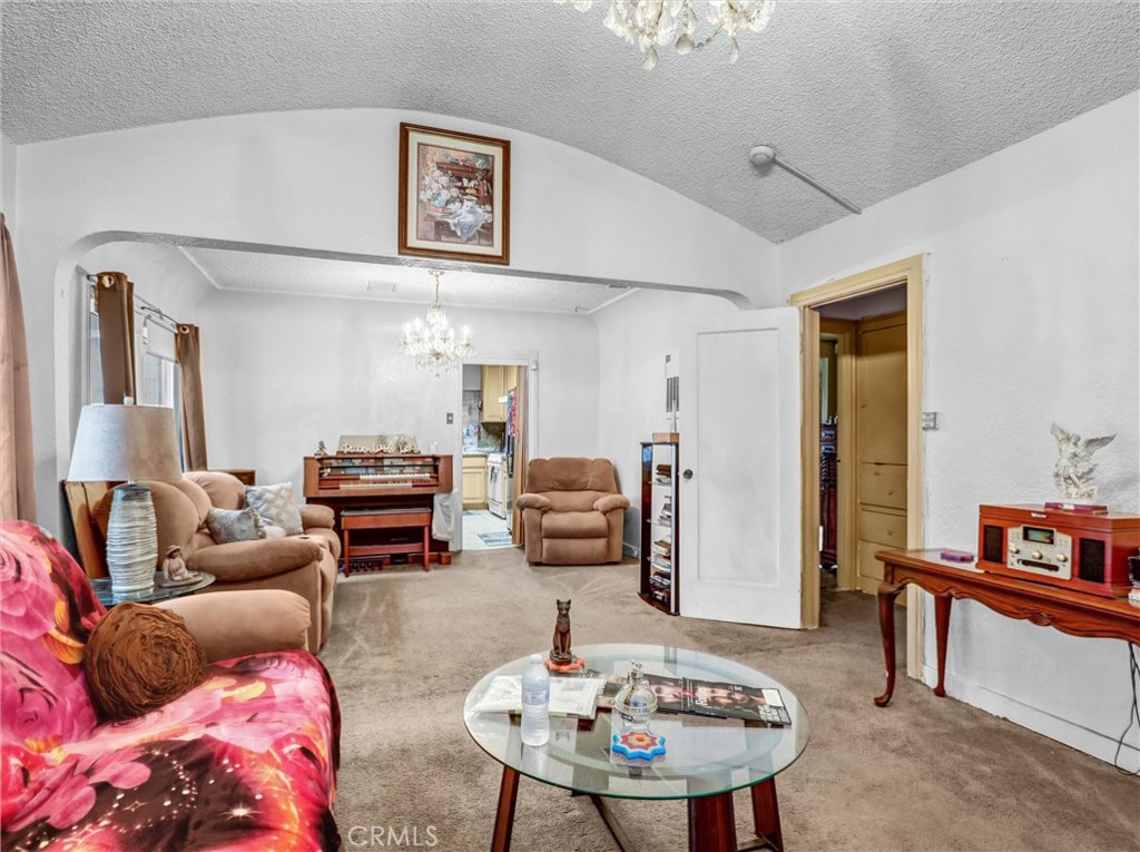 405 South Ward Avenue Compton, CA 90221 - Photo 7 of 28 a living room with furniture and a mirror