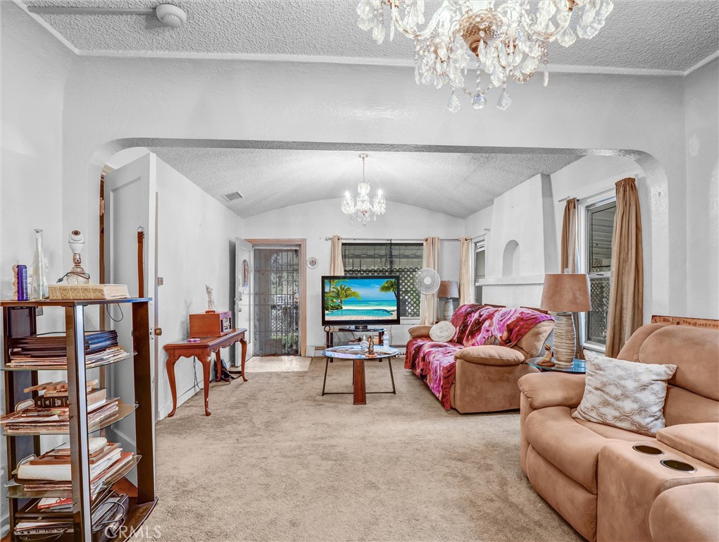 405 South Ward Avenue Compton, CA 90221 - Photo 8 of 28 a living room with furniture and a flat screen tv