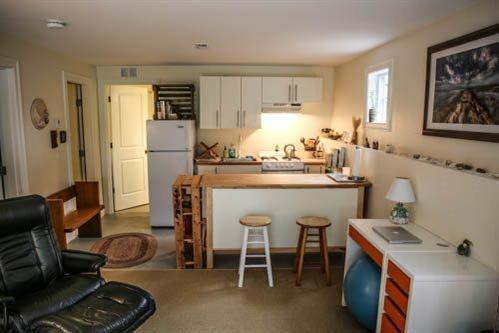 5 Yellow Brick Road Truro, MA 02666 - Photo 19 of 20 a kitchen with a sink stove and cabinets