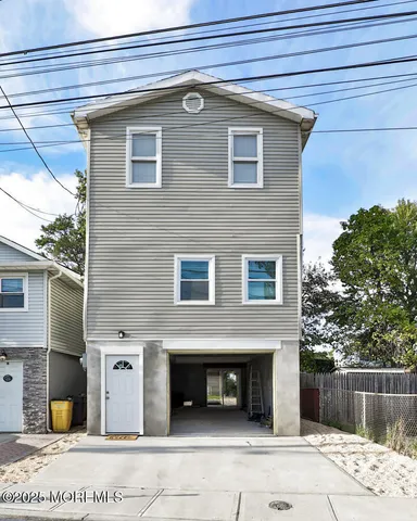 a front view of a house with garage